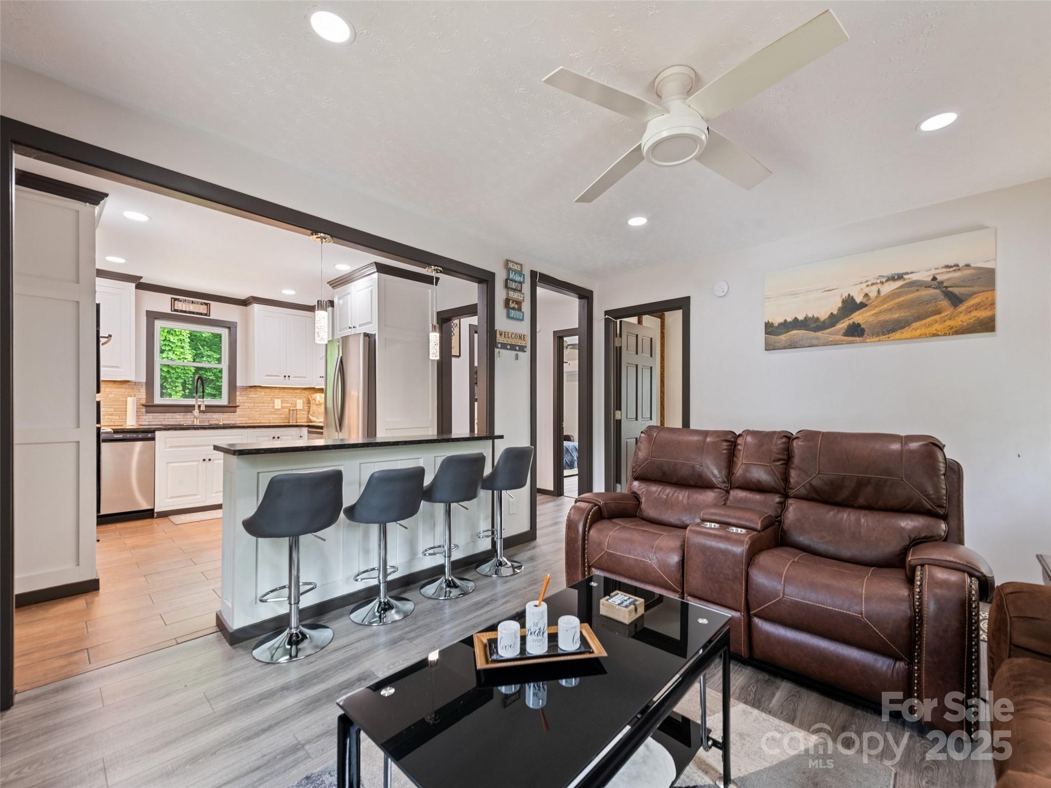 229 Yellow Bird Br Road Sylva, NC 28779 - Photo 15 of 34 a living room with furniture and a wooden floor