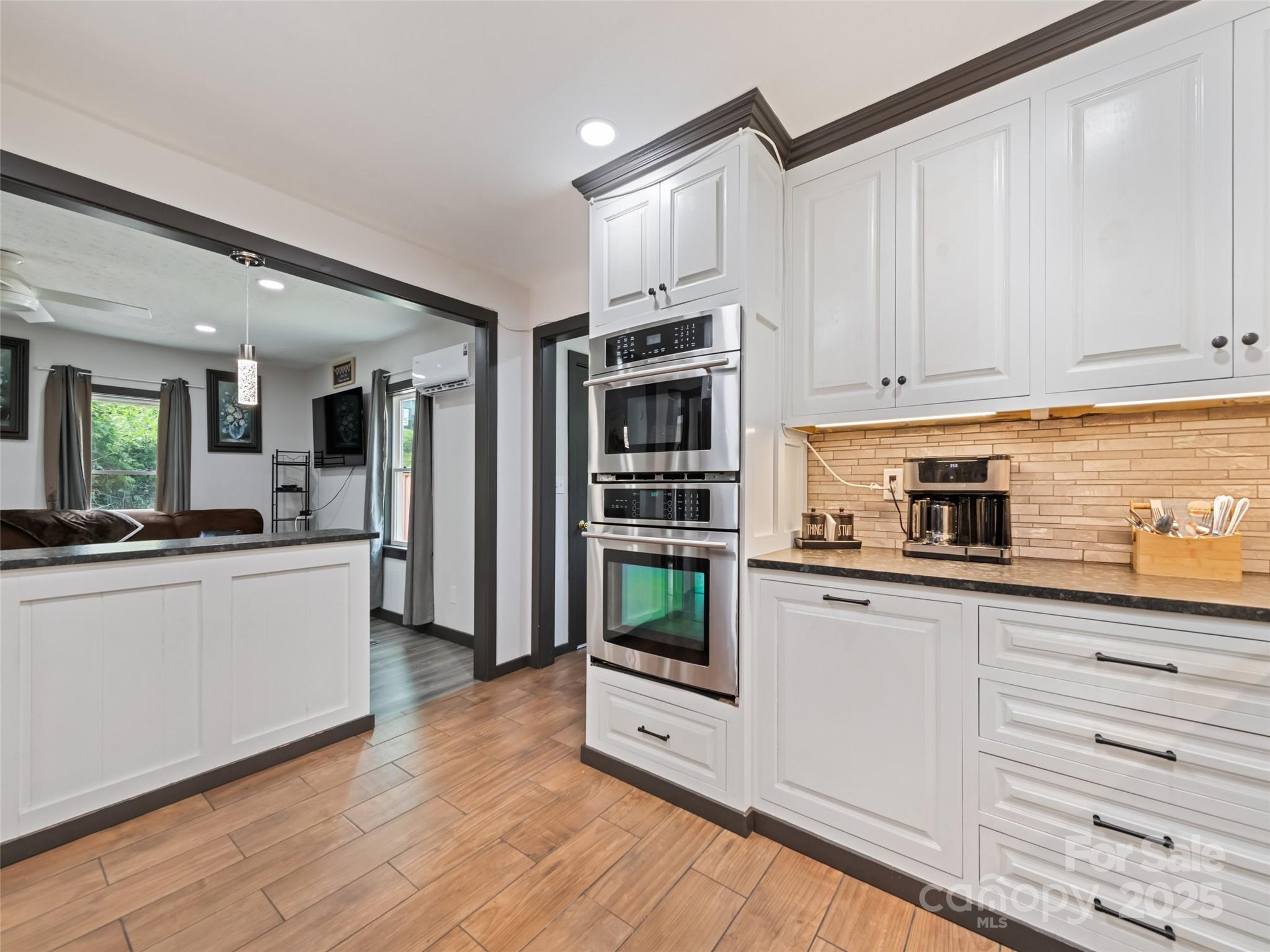 229 Yellow Bird Br Road Sylva, NC 28779 - Photo 19 of 34 a kitchen with stainless steel appliances granite countertop a refrigerator and a stove top oven