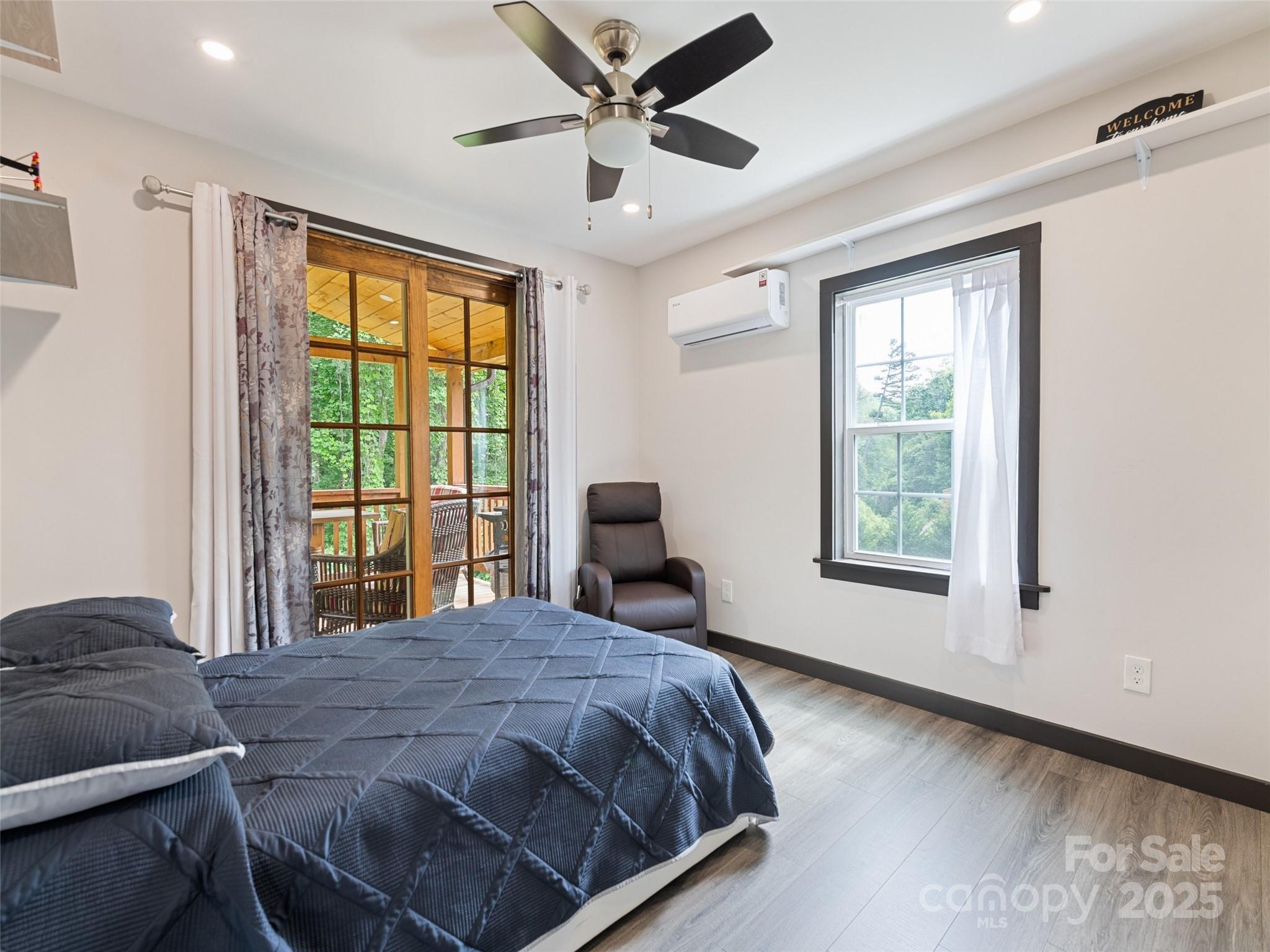 229 Yellow Bird Br Road Sylva, NC 28779 - Photo 21 of 34 a bedroom with a large bed and a large window