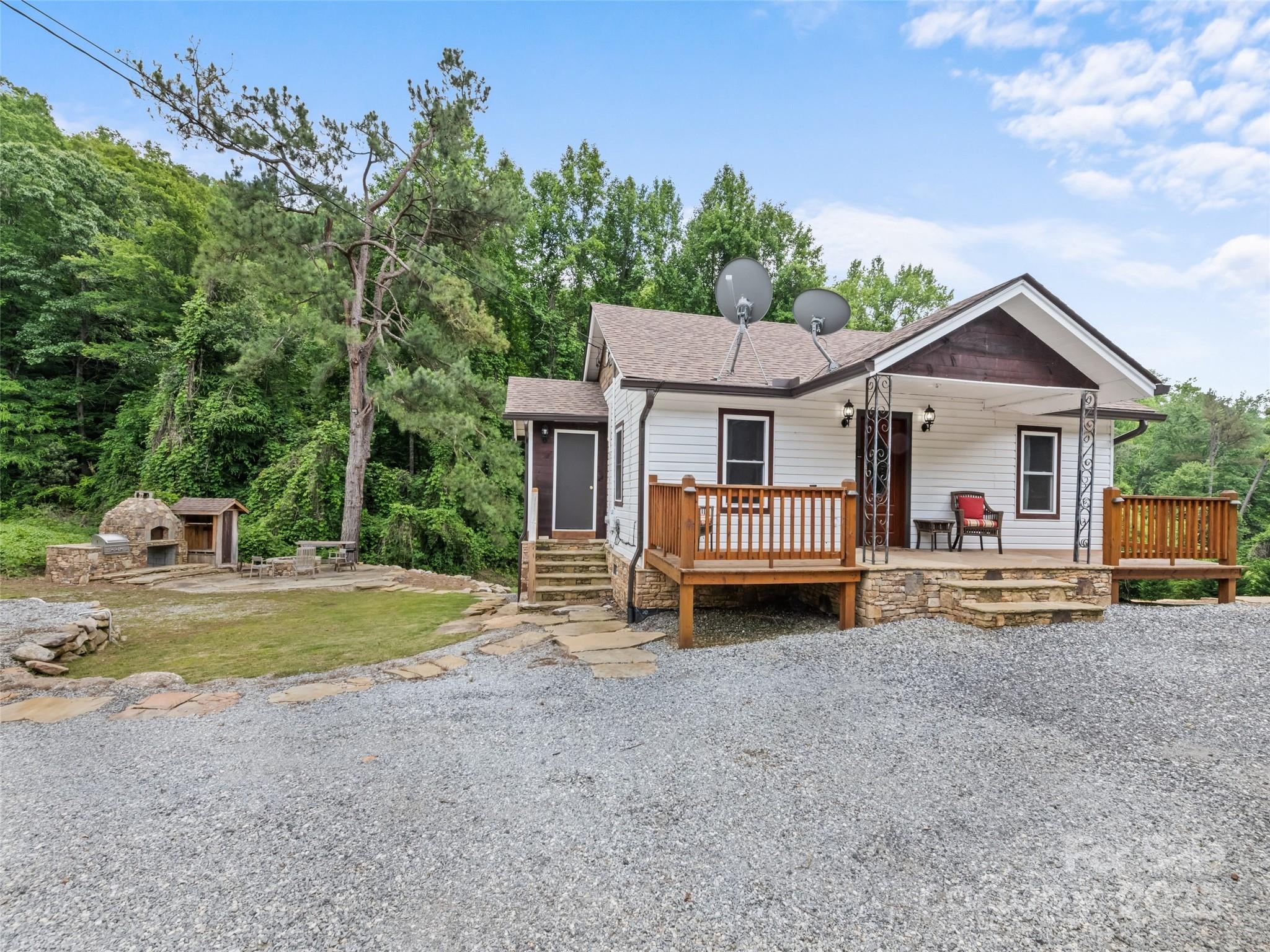 229 Yellow Bird Br Road Sylva, NC 28779 - Photo 3 of 34 a view of a house with backyard and sitting area