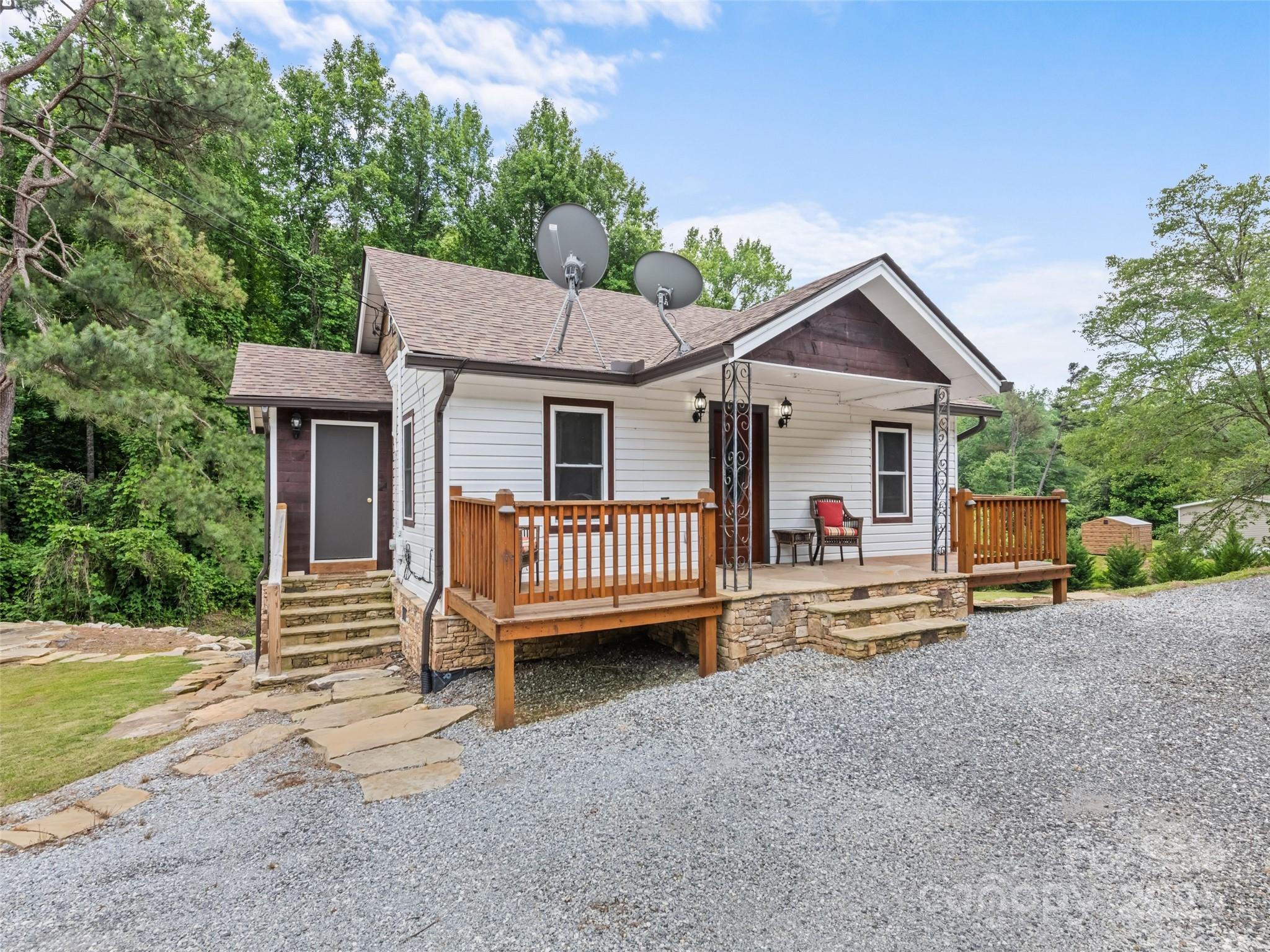 229 Yellow Bird Br Road Sylva, NC 28779 - Photo 4 of 34 a view of a house with a yard and deck