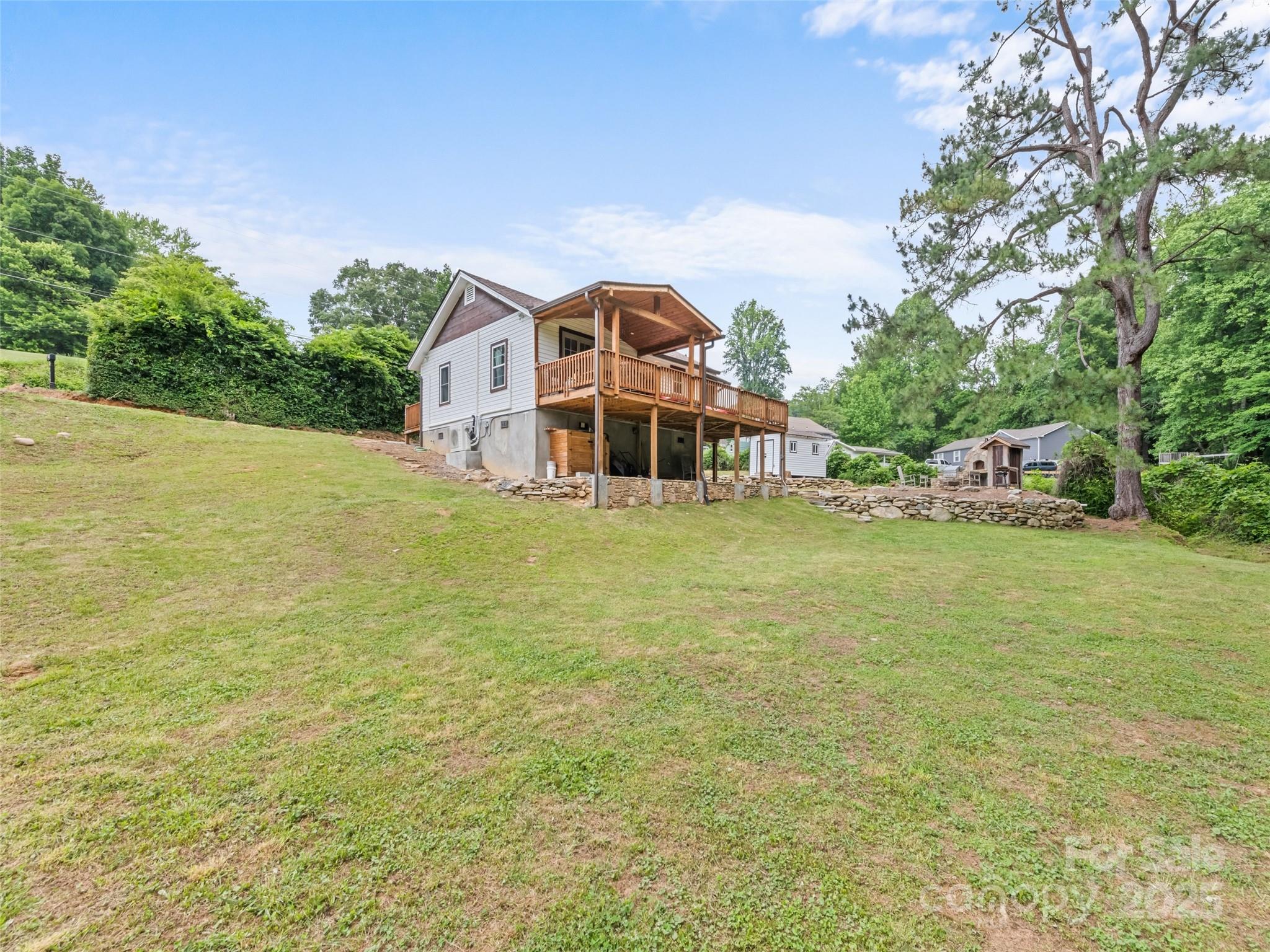 229 Yellow Bird Br Road Sylva, NC 28779 - Photo 9 of 34 a view of a house with a big yard
