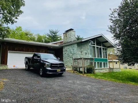 a car parked in front of house with a car parked