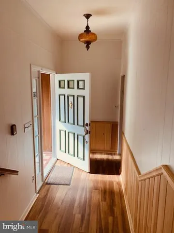 a view of a hallway view with staircase