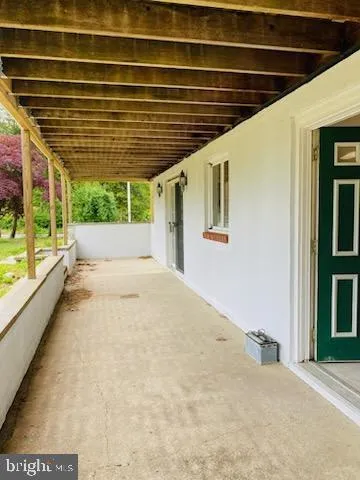 a view of hallway with wooden floor