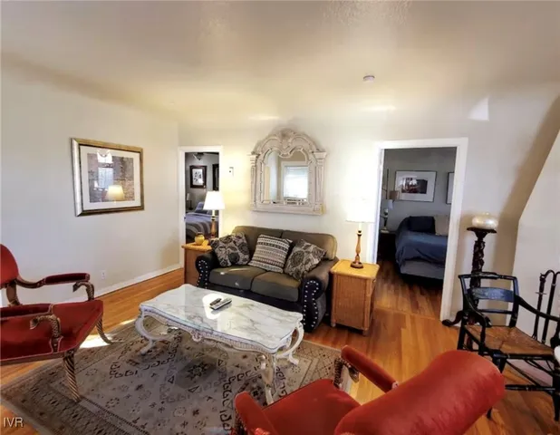 a living room with a couch and painting on the wall