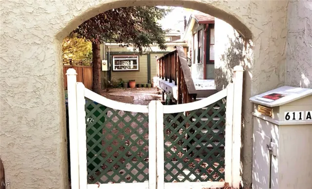 a view of a building with door and outdoor seating