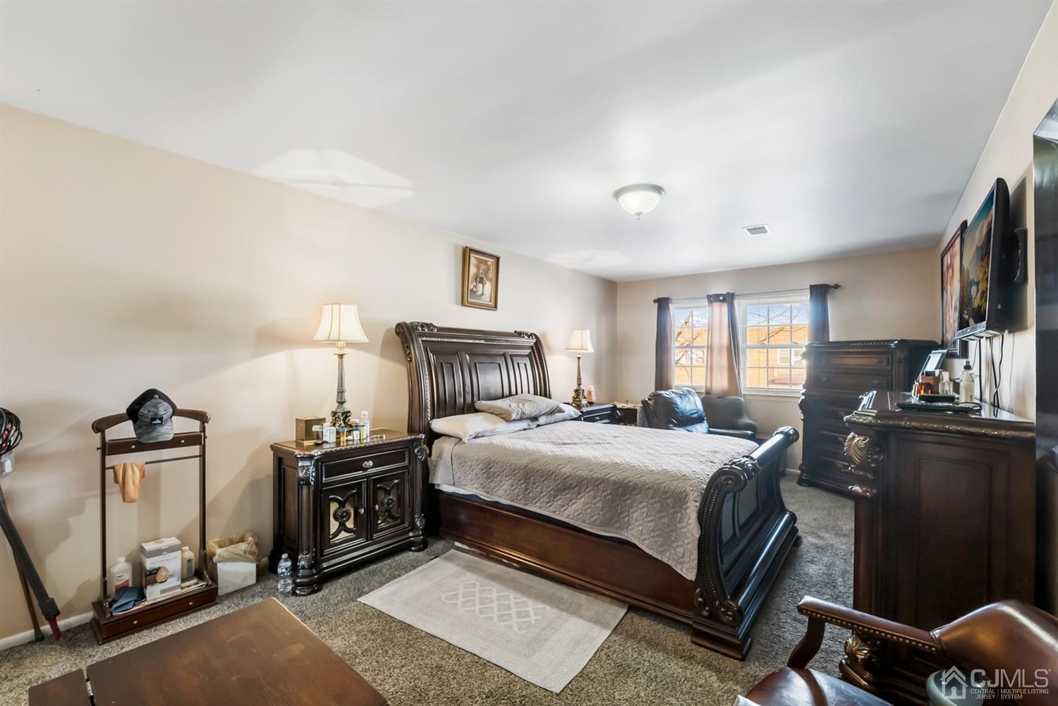 390 College Drive Edison, NJ 08817 - Photo 12 of 17 a bedroom with a bed and dresser
