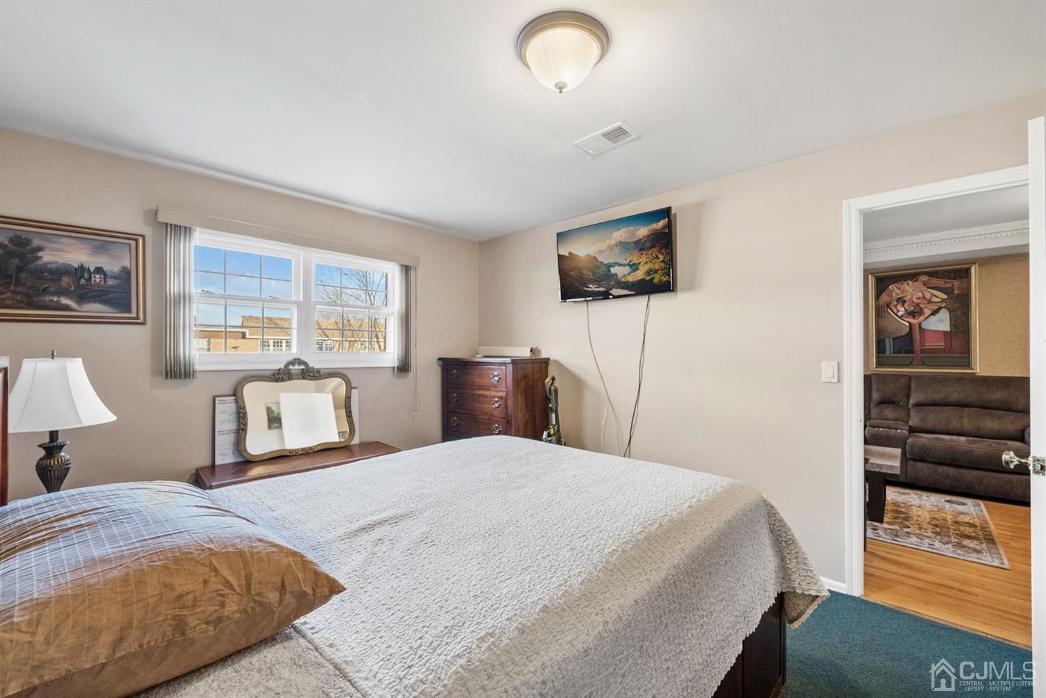 390 College Drive Edison, NJ 08817 - Photo 15 of 17 a bedroom with a bed and a window