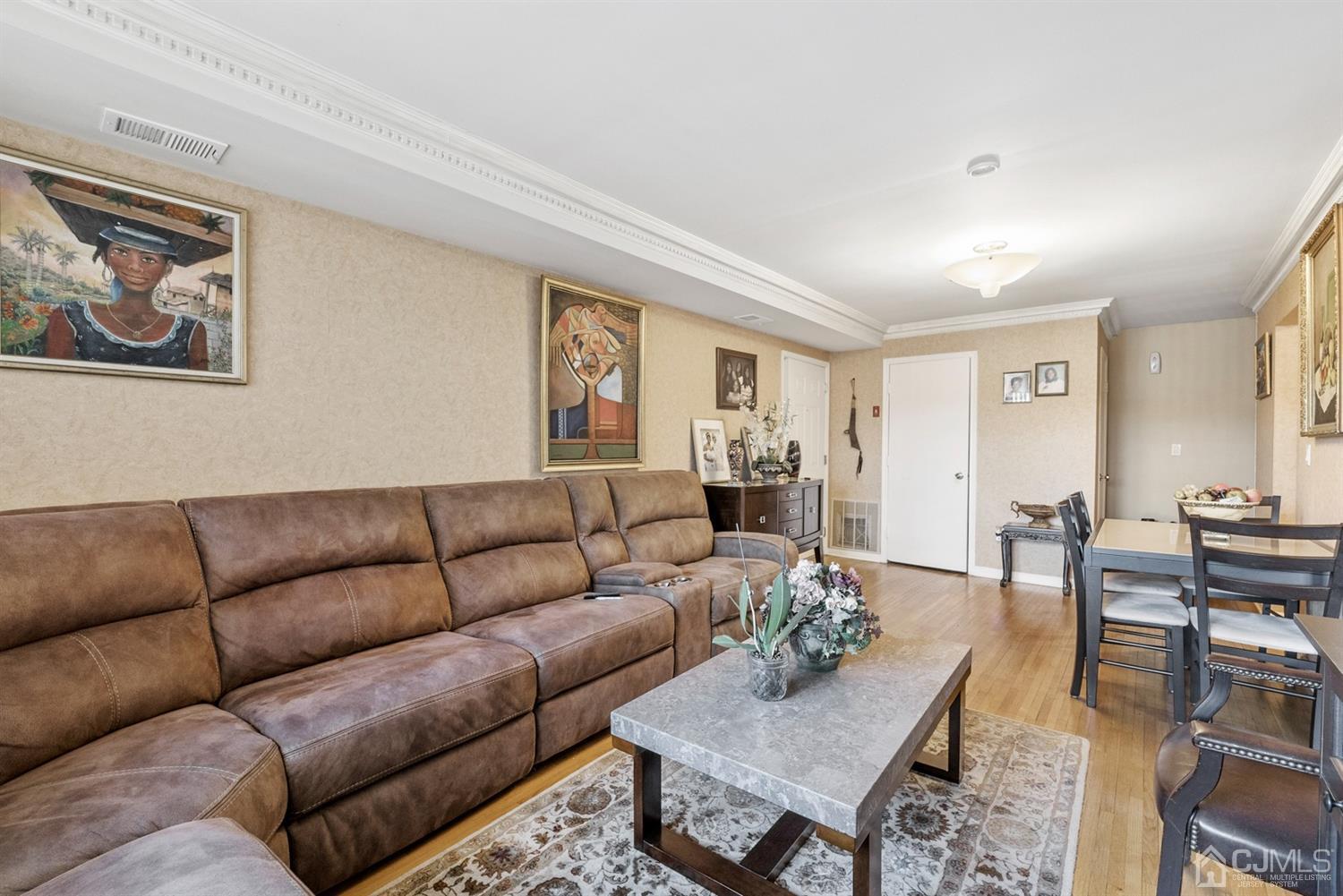 390 College Drive Edison, NJ 08817 - Photo 4 of 17 a living room with furniture and a wooden floor