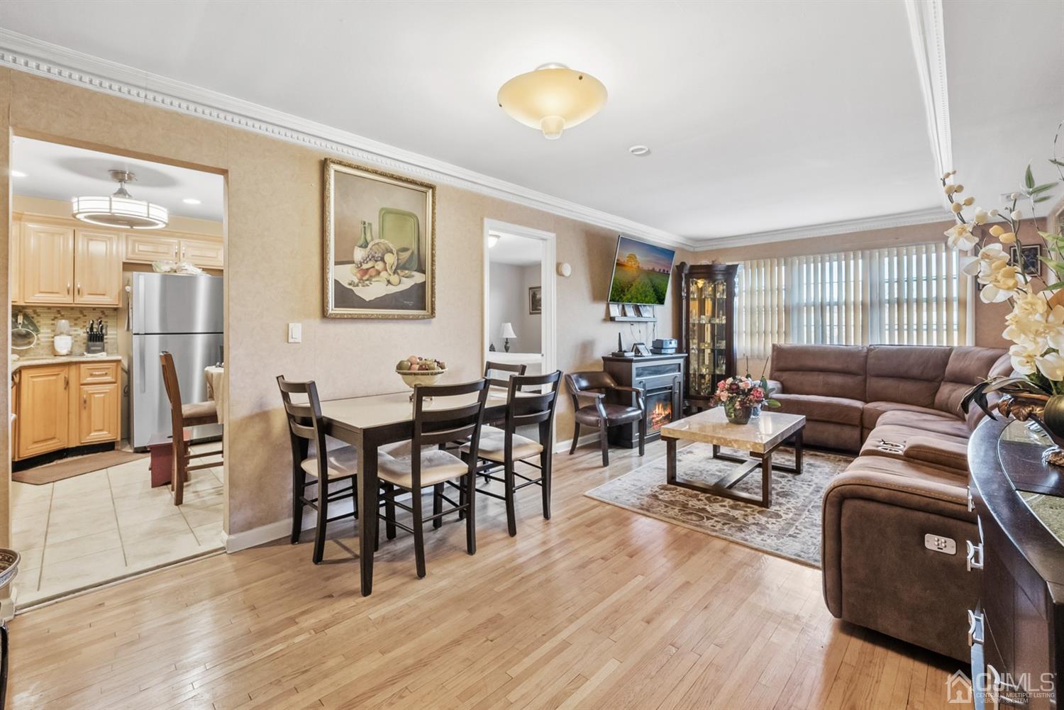 390 College Drive Edison, NJ 08817 - Photo 5 of 17 a living room with furniture dining table and a large window