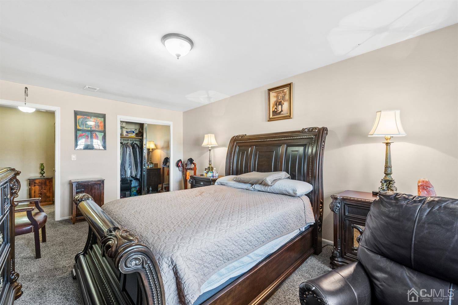 390 College Drive Edison, NJ 08817 - Photo 9 of 17 a bedroom with a bed and a dresser