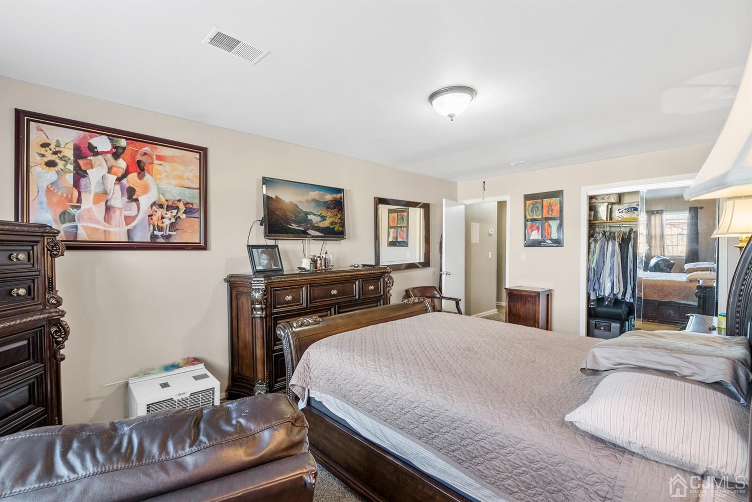 390 College Drive Edison, NJ 08817 - Photo 10 of 17 a bedroom with a bed and wooden floor