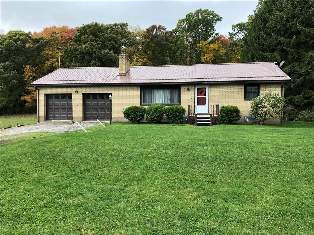 104 Reed Road Fenelton, PA 16034 - Photo 1 of 11 a front view of a house with a yard and garage