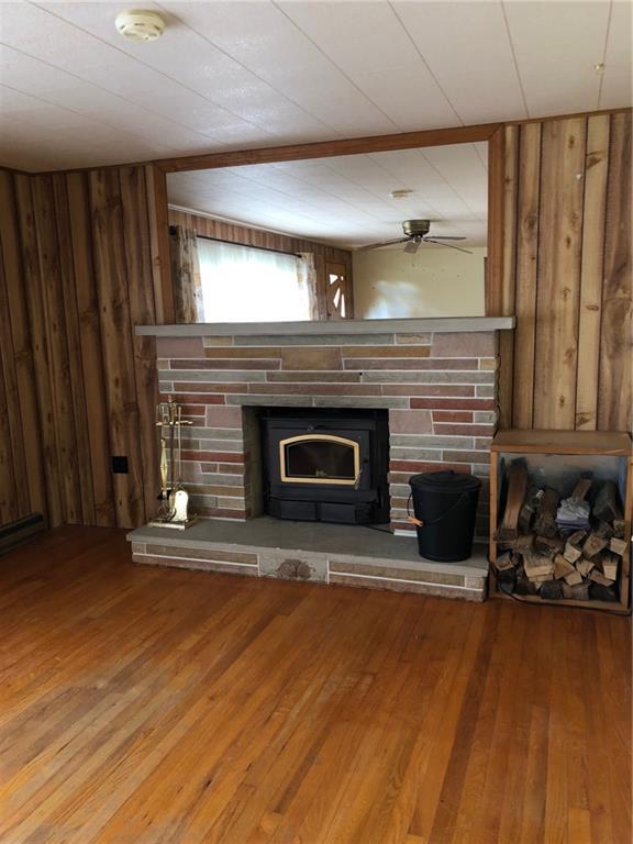 104 Reed Road Fenelton, PA 16034 - Photo 4 of 11 a living room with furniture and a fireplace