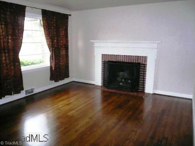 116 Oak Summit Road Winston-Salem, NC 27105 - Photo 5 of 9 Other. Living room with beautiful hardwoods and gas log fireplace