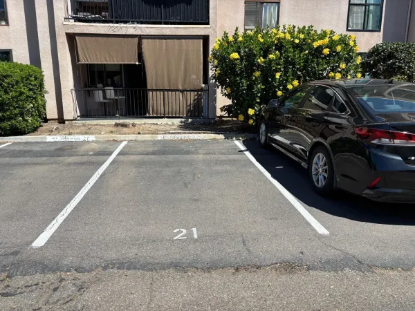 a view of a car parked in front of a house