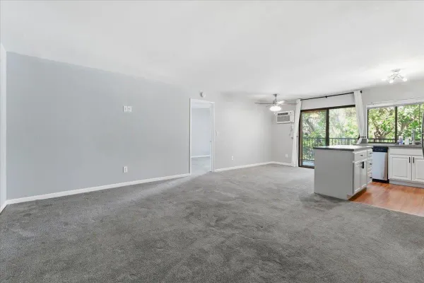 a view of an empty room with a window