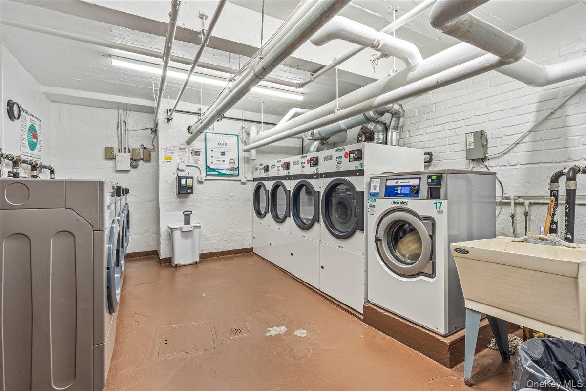 209-25 18th Avenue, Unit 6D Queens, NY 11360 - Photo 23 of 26 a utility room with dryer and washer