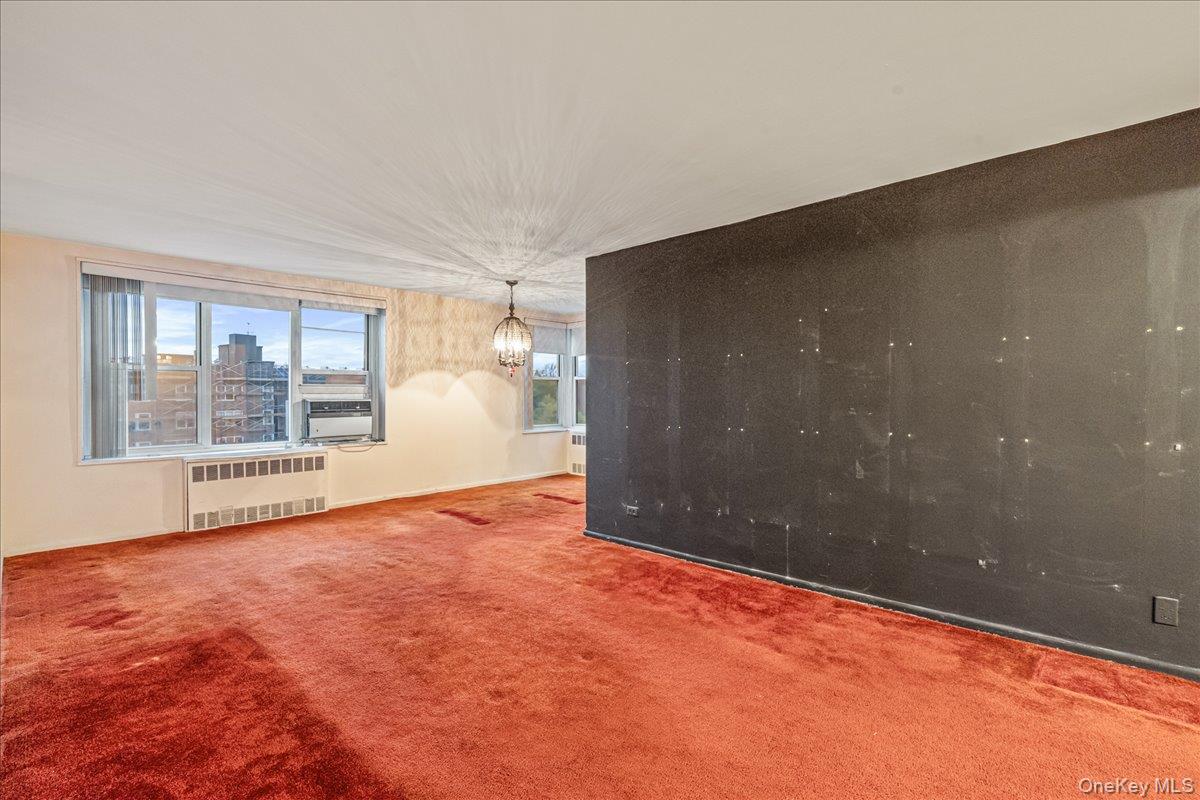 209-25 18th Avenue, Unit 6D Queens, NY 11360 - Photo 7 of 26 a view of an empty room with a window