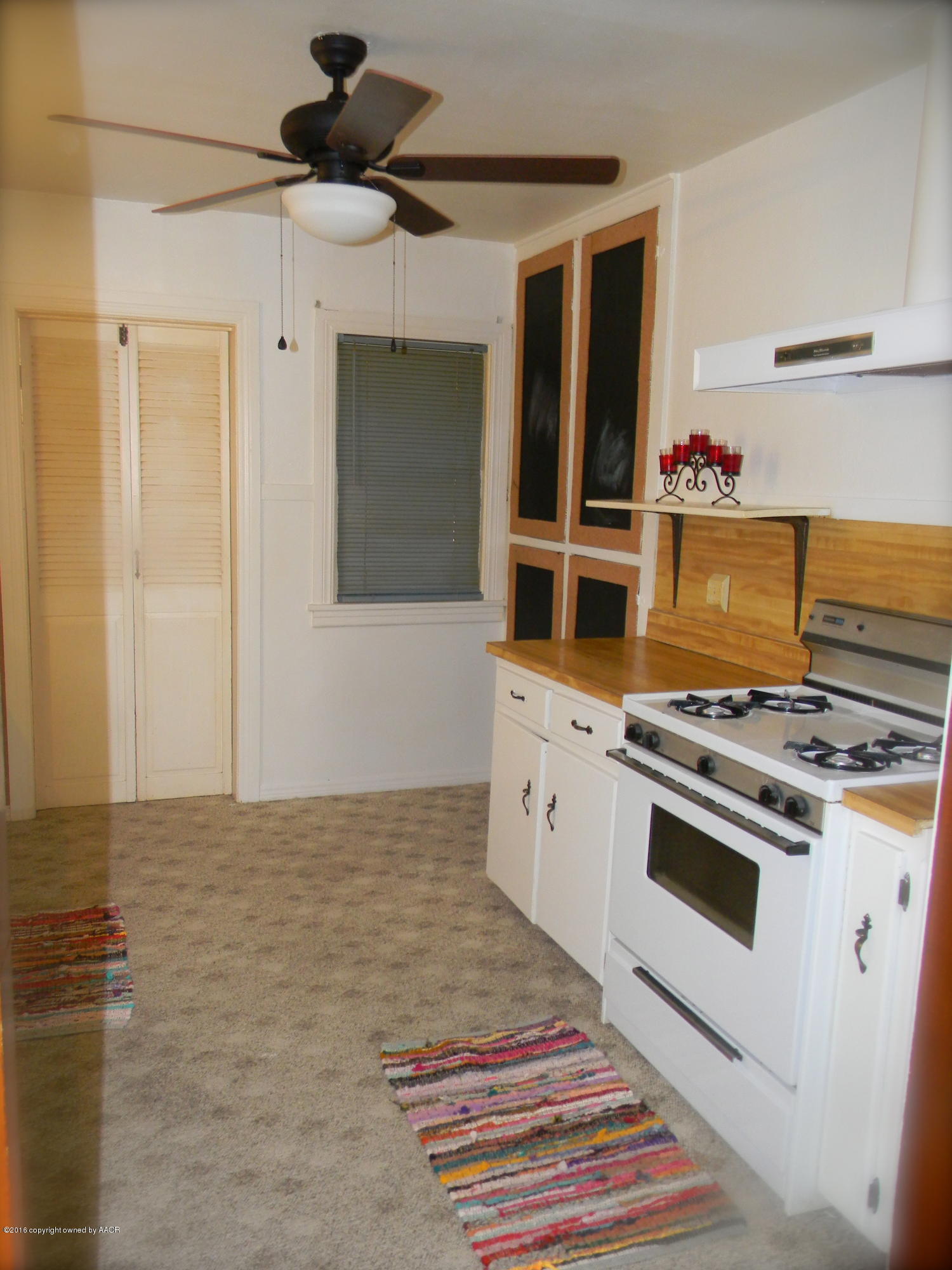 4109 South Jackson Street Amarillo, TX 79110 - Photo 4 of 10 a kitchen with stainless steel appliances a stove and a refrigerator