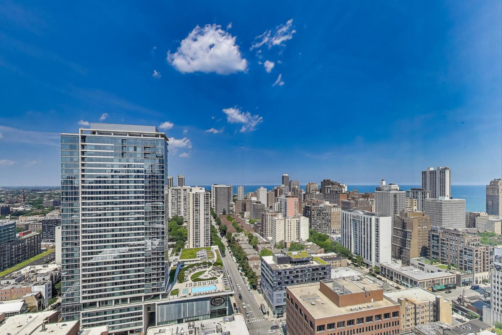 1122 North Clark Street, Unit 3304 Chicago, IL 60610 - Photo 11 of 32 a view of a city with tall buildings