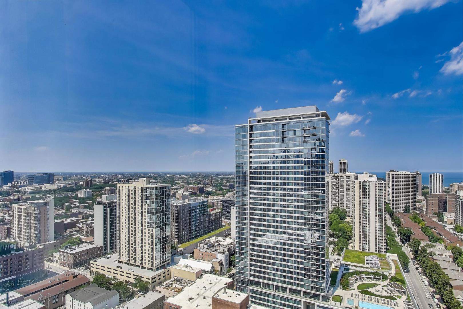 1122 North Clark Street, Unit 3304 Chicago, IL 60610 - Photo 12 of 32 a view of a city with tall buildings