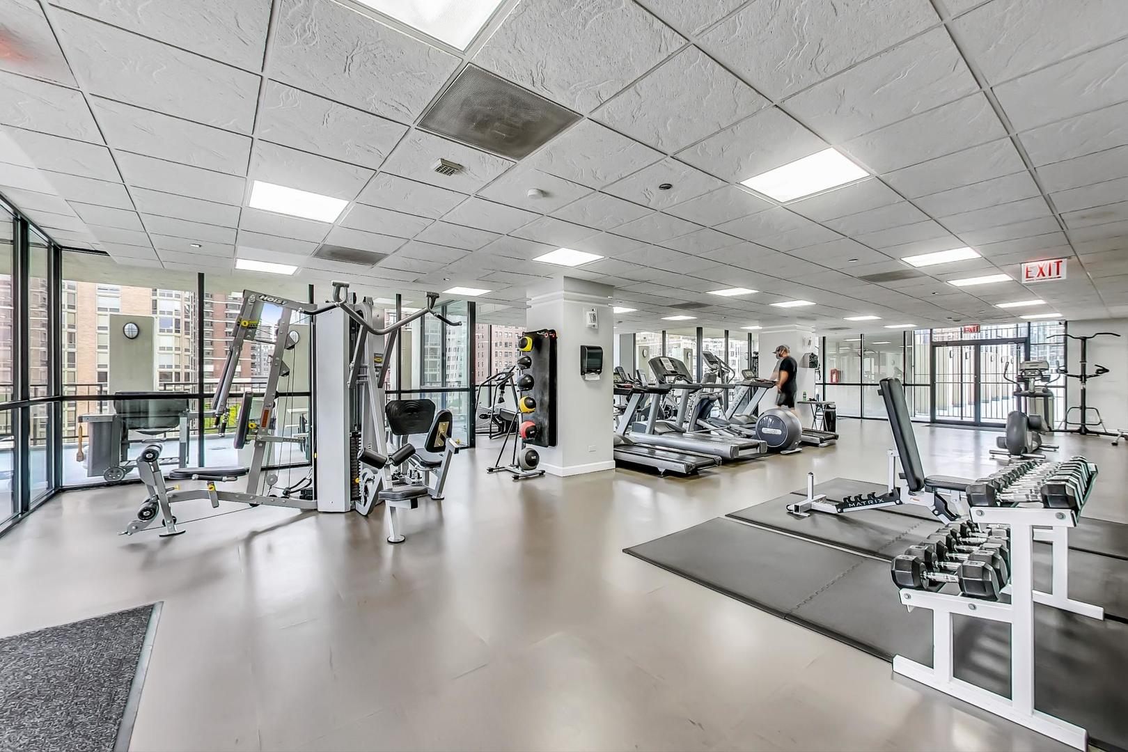 1122 North Clark Street, Unit 3304 Chicago, IL 60610 - Photo 19 of 32 a view of a room with gym equipment