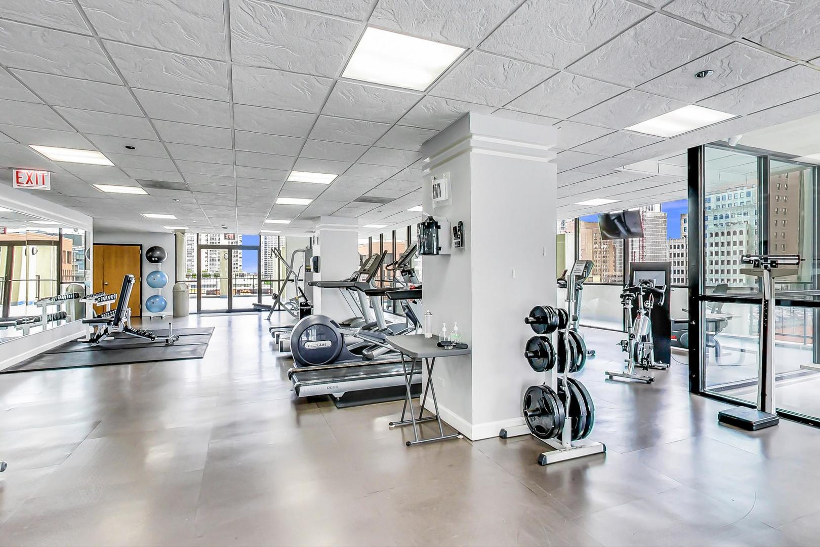 1122 North Clark Street, Unit 3304 Chicago, IL 60610 - Photo 23 of 32 a view of a room with gym equipment
