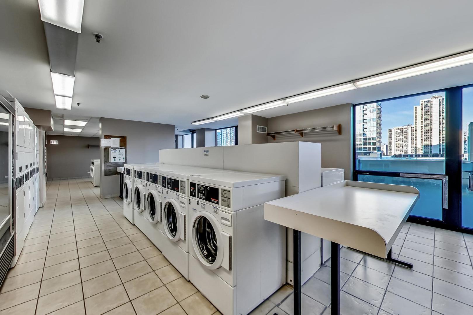 1122 North Clark Street, Unit 3304 Chicago, IL 60610 - Photo 24 of 32 a kitchen with stainless steel appliances a stove a sink and a refrigerator