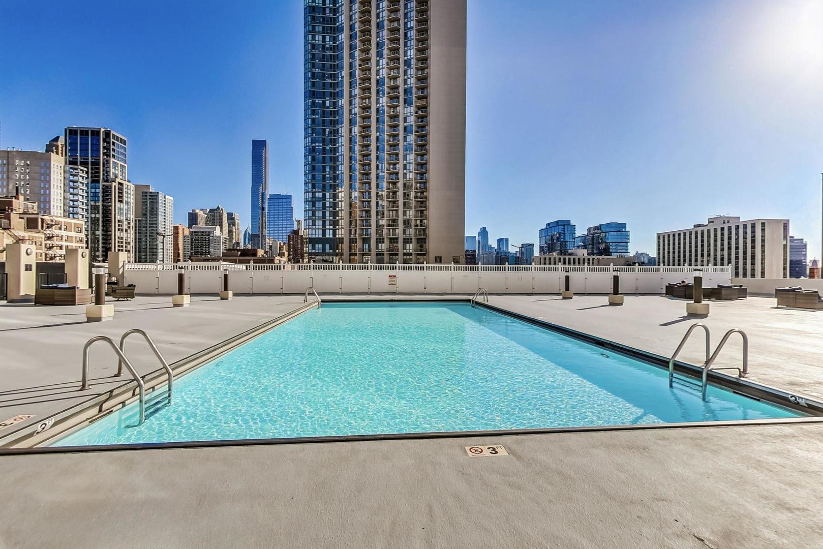 1122 North Clark Street, Unit 3304 Chicago, IL 60610 - Photo 25 of 32 a view of swimming pool with outdoor seating and plants