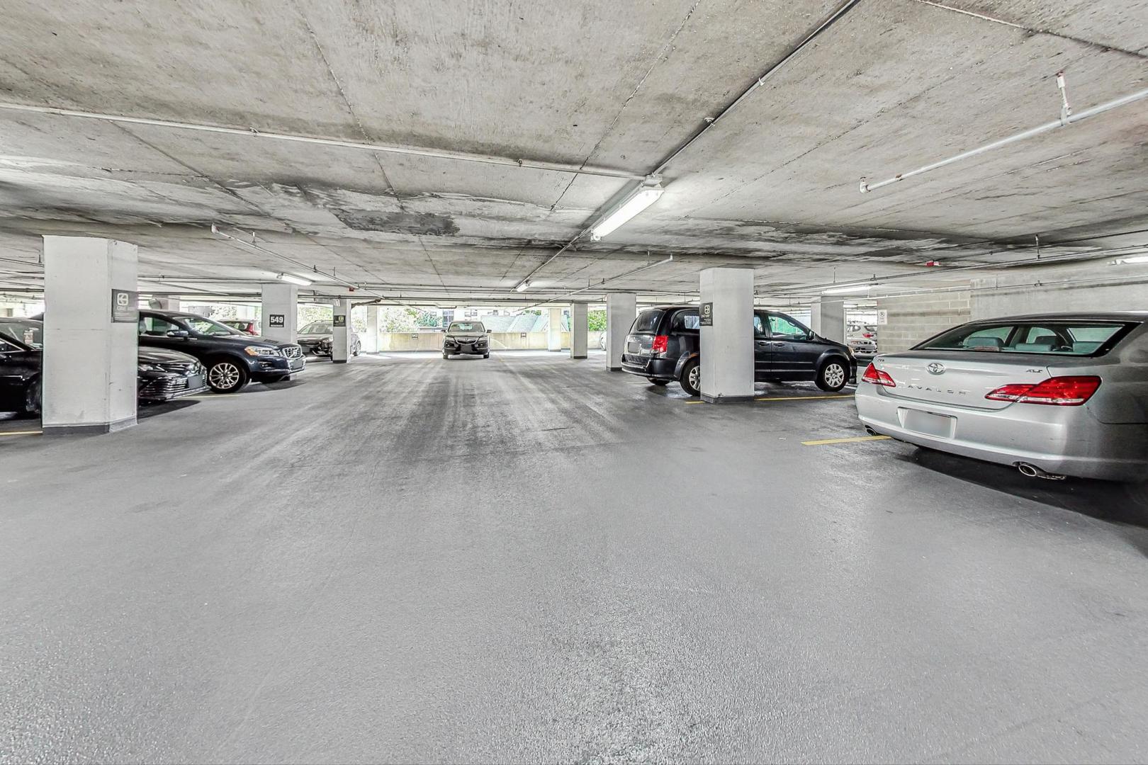 1122 North Clark Street, Unit 3304 Chicago, IL 60610 - Photo 30 of 32 a view of parking garage with cars