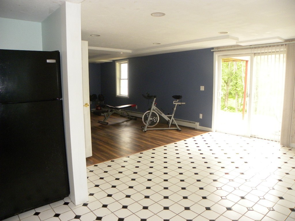 82 Sandersdale Road Charlton, MA 01507 - Photo 27 of 30 a living room with a black white checkered table
