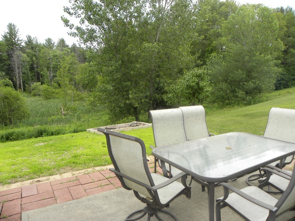 82 Sandersdale Road Charlton, MA 01507 - Photo 29 of 30 a view of a backyard with table and chairs