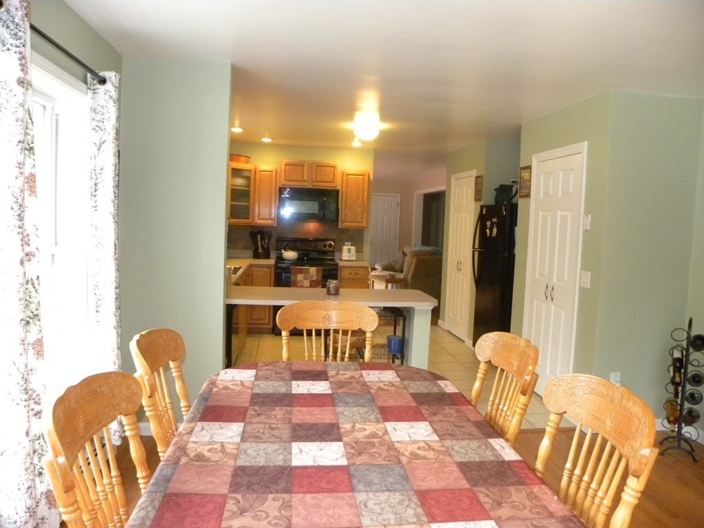 82 Sandersdale Road Charlton, MA 01507 - Photo 6 of 30 a living room with furniture a rug and a flat screen tv