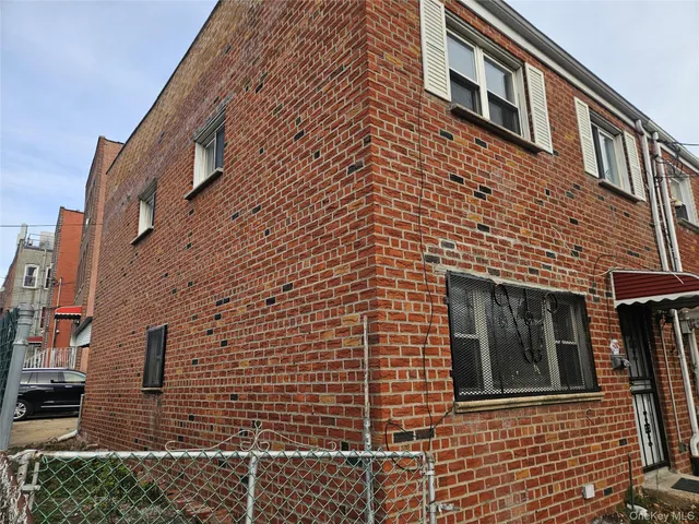 a view of a brick building with many windows