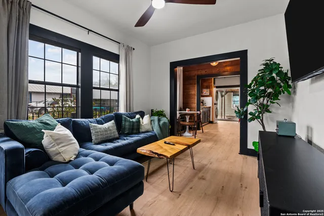 a living room with furniture and a large window