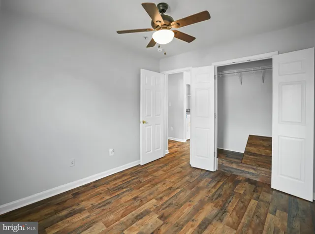a view of an empty room and wooden floor