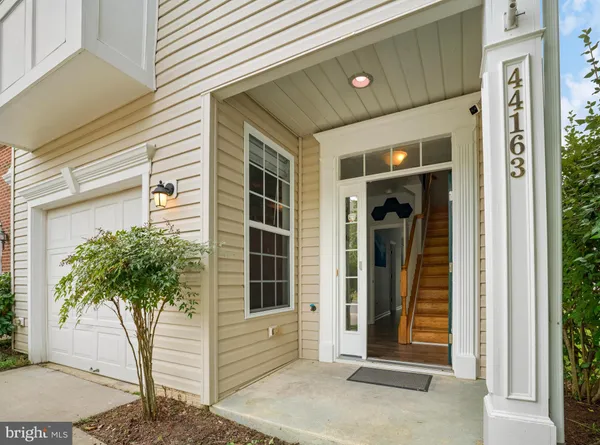 a potted plant in front of a house