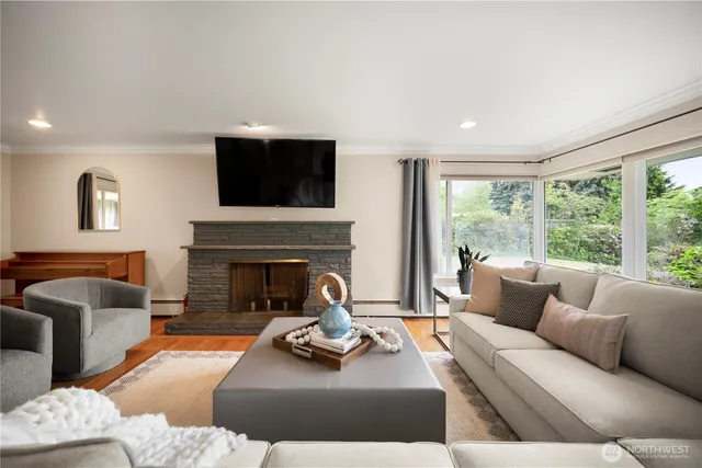 a living room with furniture and a fireplace