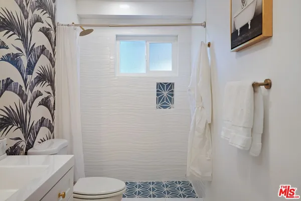 a bathroom with a toilet and a sink