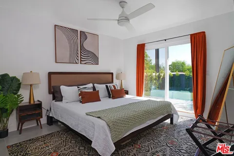 a bedroom with a large bed and a window