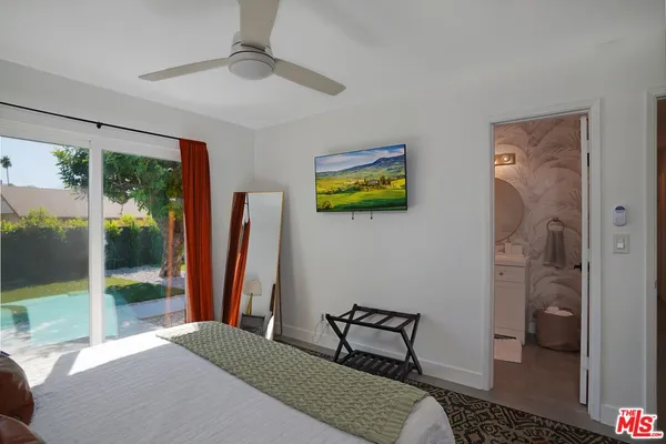 a bedroom with a bed and a view of bathroom