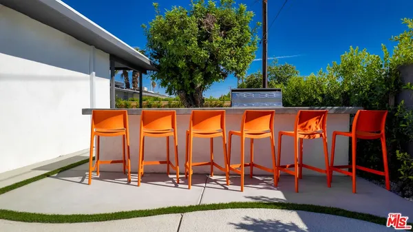 a view of swimming pool with chairs