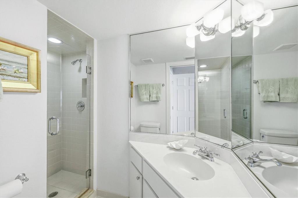 5000 Gasparilla Road, Unit 16 Boca Grande, FL 33921 - Photo 15 of 46 a bathroom with a sink a toilet and shower