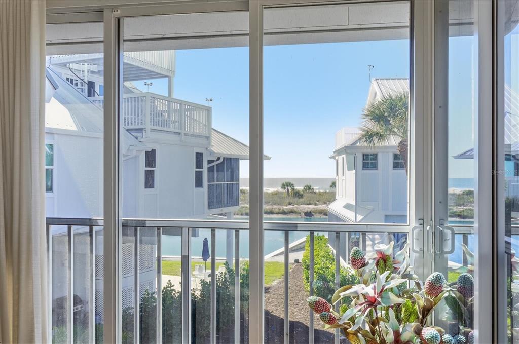 5000 Gasparilla Road, Unit 16 Boca Grande, FL 33921 - Photo 18 of 46 a view of a balcony with potted plants