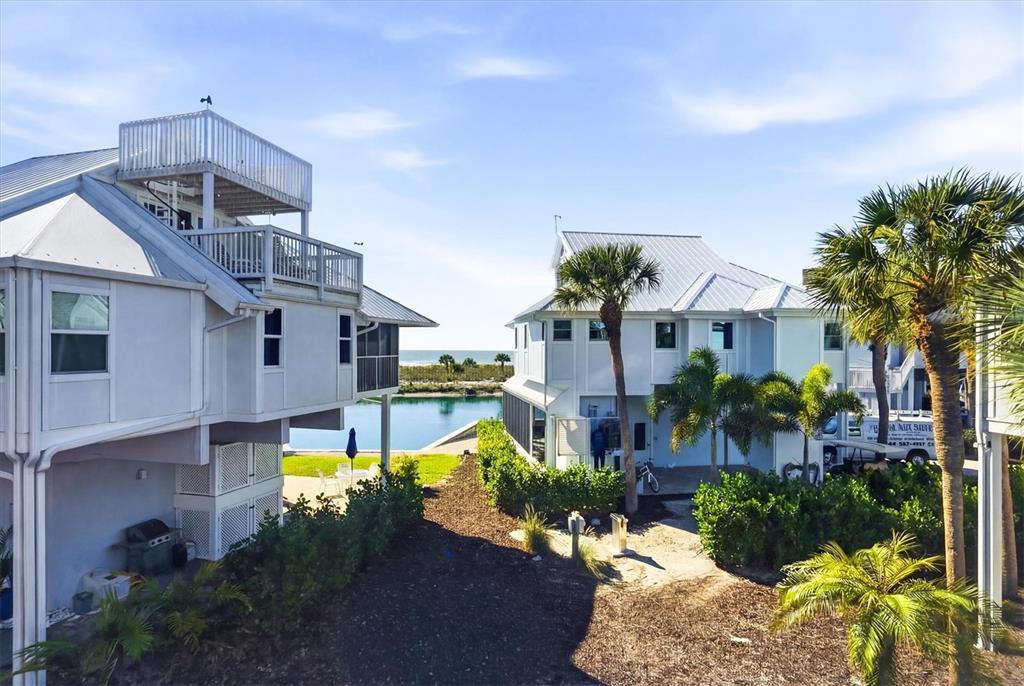 5000 Gasparilla Road, Unit 16 Boca Grande, FL 33921 - Photo 19 of 46 a front view of a house with a garden