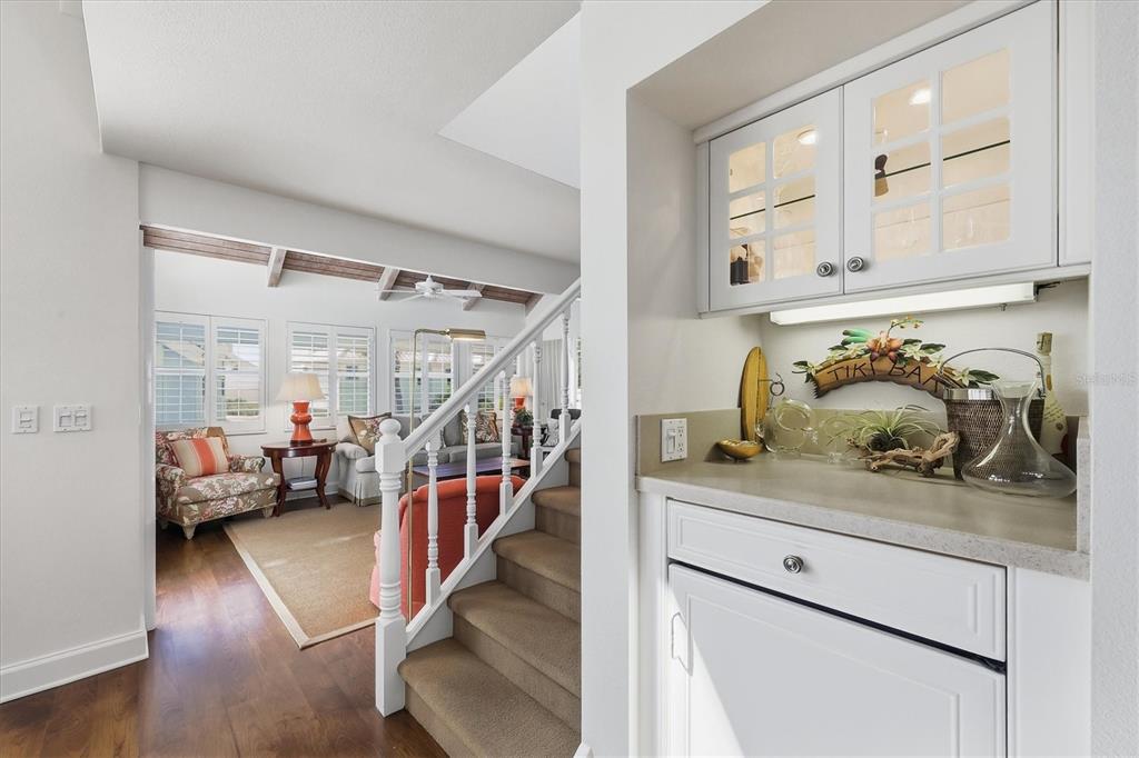 5000 Gasparilla Road, Unit 16 Boca Grande, FL 33921 - Photo 20 of 46 a hallway with white cabinets and couches