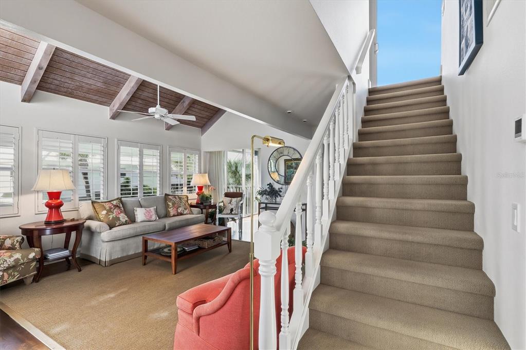 5000 Gasparilla Road, Unit 16 Boca Grande, FL 33921 - Photo 21 of 46 a living room with furniture and a chandelier