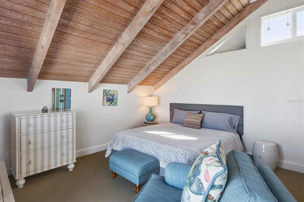 5000 Gasparilla Road, Unit 16 Boca Grande, FL 33921 - Photo 22 of 46 a bedroom with a bed and a dresser